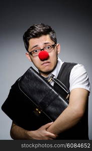 Funny businessman with clown nose