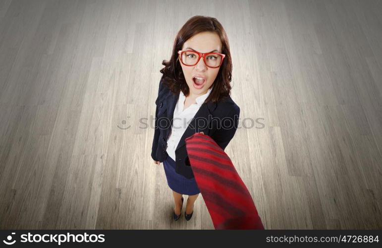 Funny businesswoman. Top view of businesswoman pulling tie of boss