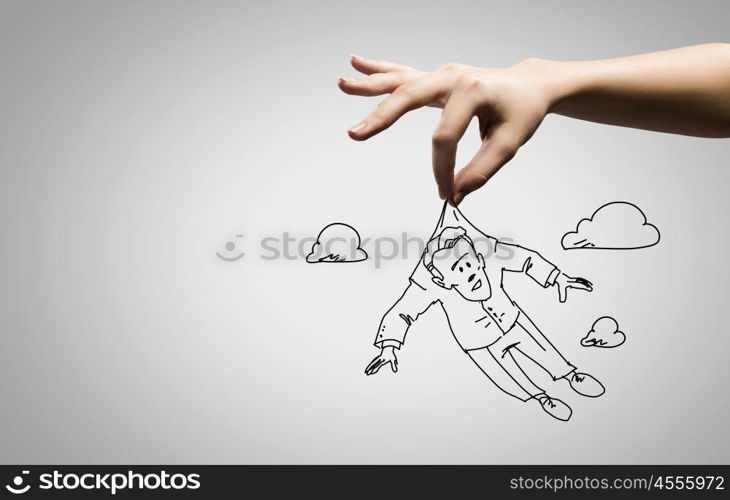 Funny caricature. Close up of human hand and sketch of businessman