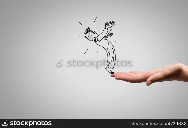 Funny caricature. Close up of human hand and sketch of businessman