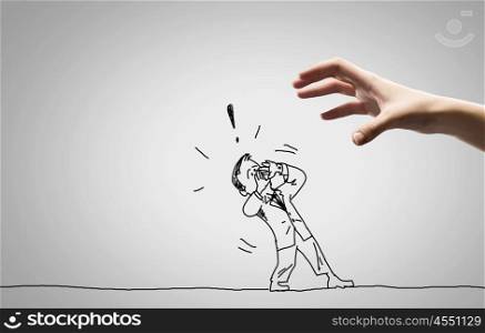 Funny caricature. Close up of human hand catching running away businessman