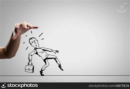 Funny caricature. Close up of human hand catching running away businessman