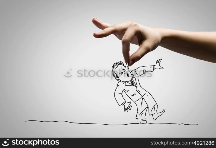 Funny caricature. Close up of human hand catching running away businessman