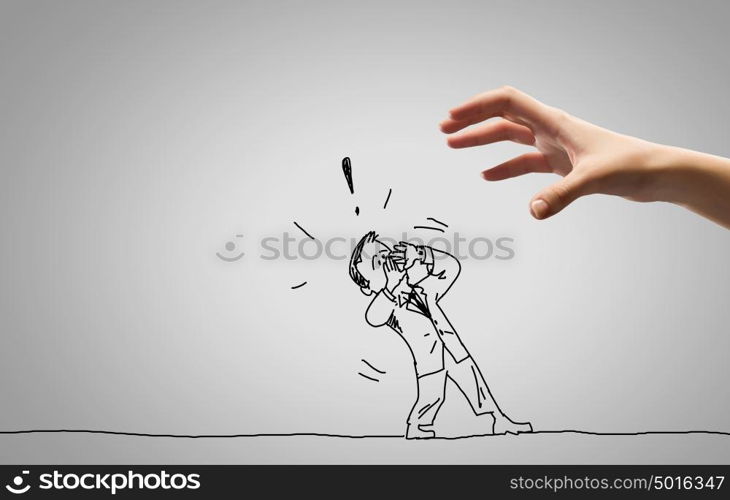 Funny caricature. Close up of human hand catching running away businessman