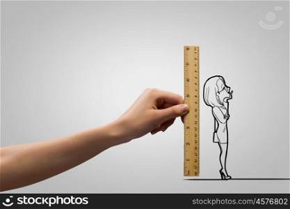 Funny caricature. Human hand measuring with ruler caricature of businesswoman