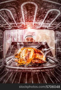 Funny chef overlooked roast chicken in the oven, so she had scorched, view from the inside of the oven. Cook perplexed and angry. Loser is destiny!
