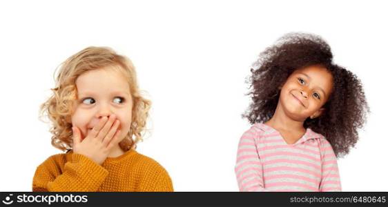 Funny child covering his mouth and a girl with afro hair looking. Funny child covering his mouth and a girl with afro hair looking him isolated on a white background