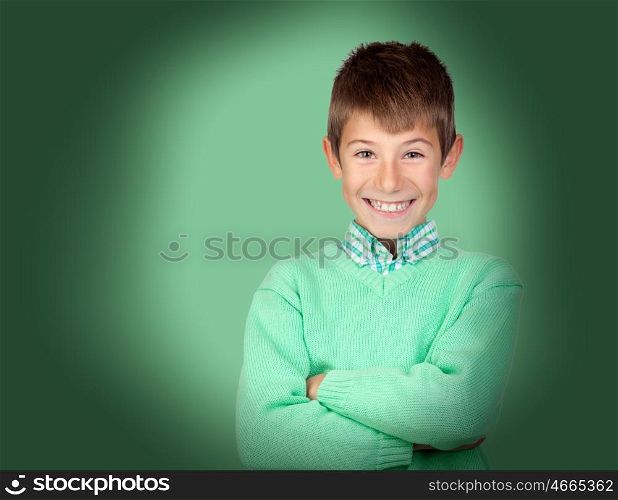 Funny child smiling on a over green background