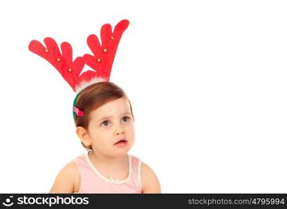 Funny child wearing christmas reindeer horns isolated on a white background