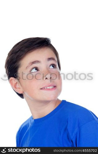 Funny child with ten years old and blue t-shirt looking up isolated on a white background