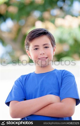 Funny child with ten years old with blue t-shirt outside