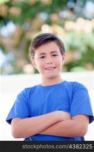 Funny child with ten years old with blue t-shirt outside