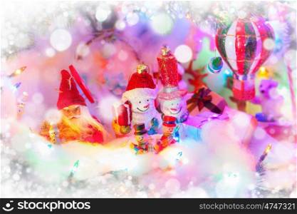 Funny Christmas decorative toys - snowman, Santa Claus, gift boxes on snow