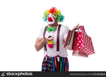 Funny clown after shopping bags isolated on white background. Funny clown with shopping bags isolated on white background