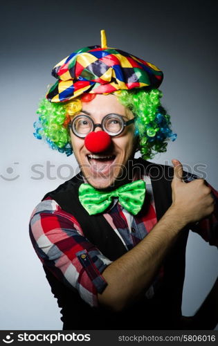 Funny clown against the dark background