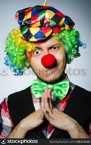 Funny clown against the dark background