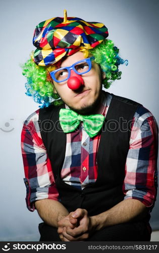 Funny clown against the dark background