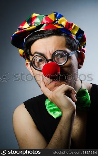 Funny clown against the dark background