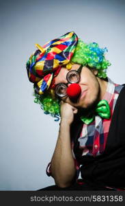 Funny clown against the dark background