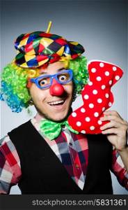 Funny clown against the dark background