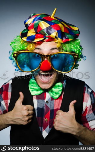 Funny clown against the dark background