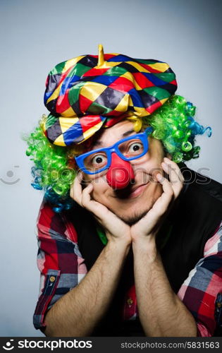 Funny clown against the dark background