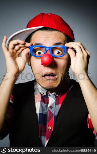 Funny clown against the dark background