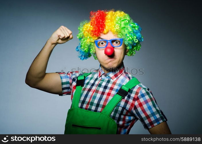 Funny clown against the dark background