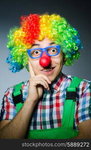 Funny clown against the dark background