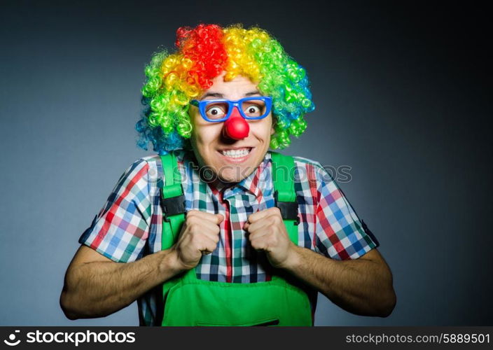 Funny clown against the dark background