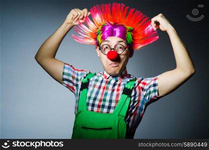 Funny clown against the grey background