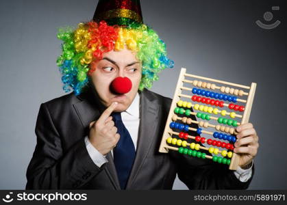 Funny clown businessman with abacus