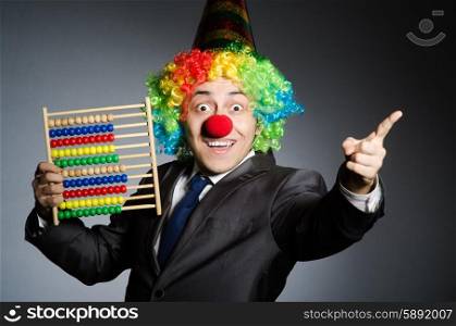 Funny clown businessman with abacus