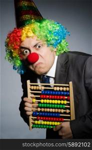 Funny clown businessman with abacus