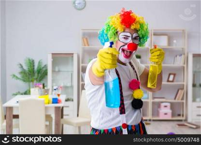 Funny clown doing cleaning at home