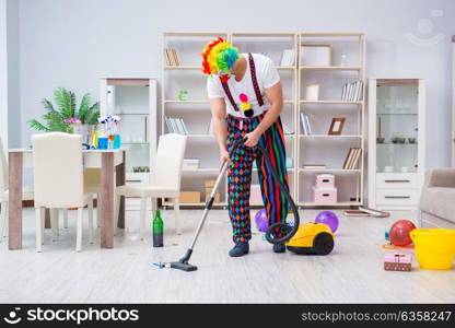 Funny clown doing cleaning at home