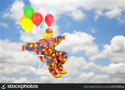 Funny clown flying through the sky in his lawn chair with balloons