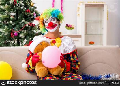 Funny clown in Christmas celebration concept . The funny clown in christmas celebration concept 