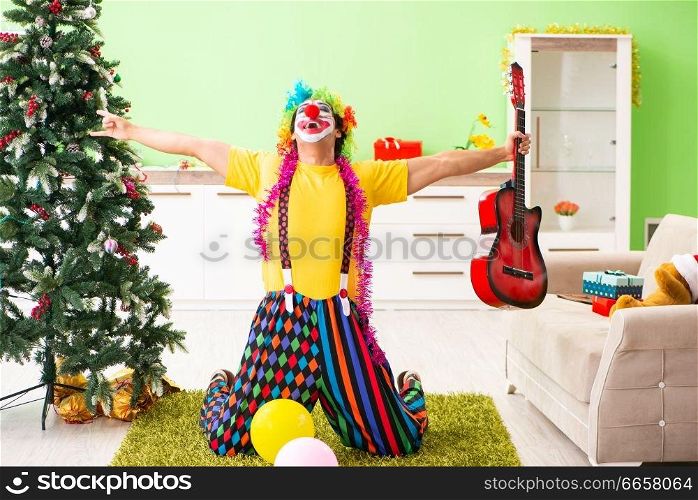 Funny clown in Christmas celebration concept . The funny clown in christmas celebration concept