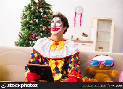 Funny clown in Christmas celebration concept . The funny clown in christmas celebration concept 