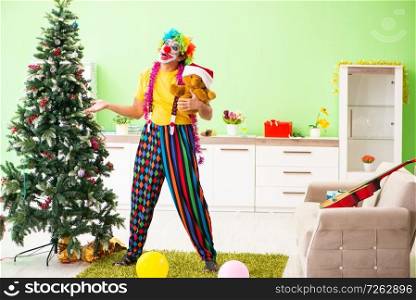 Funny clown in Christmas celebration concept . The funny clown in christmas celebration concept
