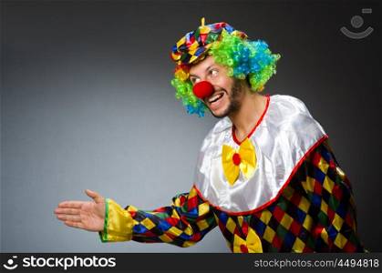 Funny clown in colourful costume