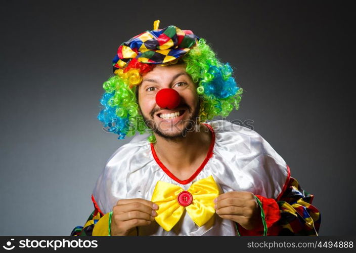 Funny clown in colourful costume