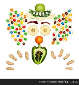 Funny clown made of vegetables and fruits in a kids menu isolated on white.