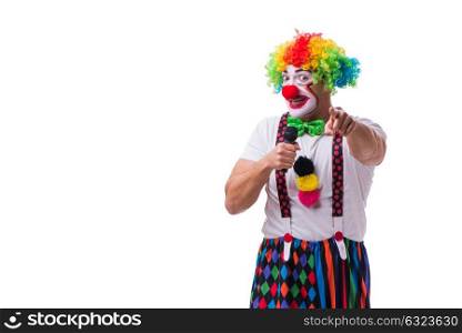 Funny clown with a microphone singing karaoke isolated on white . Funny clown with a microphone singing karaoke isolated on white background