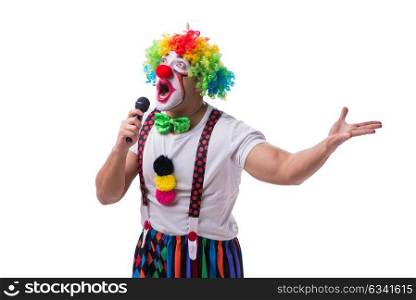 Funny clown with a microphone singing karaoke isolated on white . Funny clown with a microphone singing karaoke isolated on white background