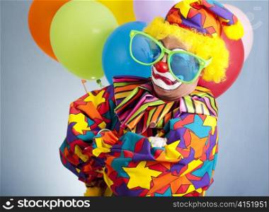 Funny clown with oversized glasses making a gangsta pose.