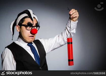 Funny clown with sticks of dynamite