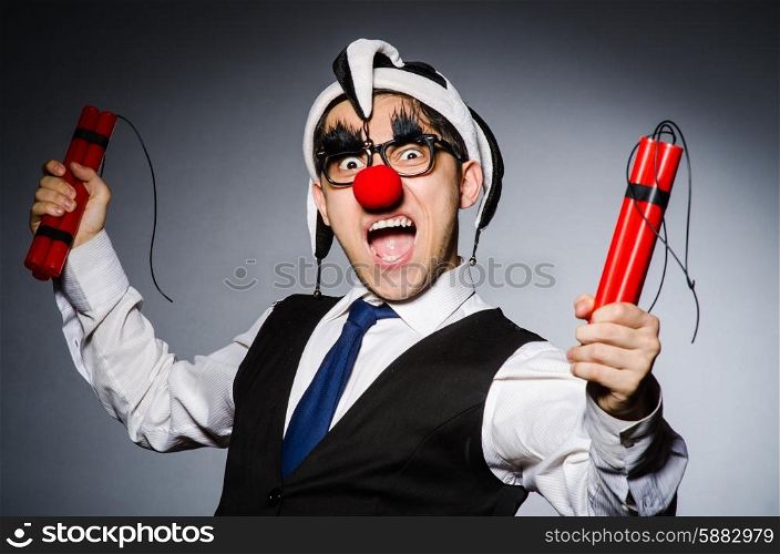 Funny clown with sticks of dynamite