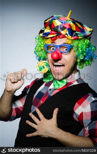 Funny clown with sweet lollipop